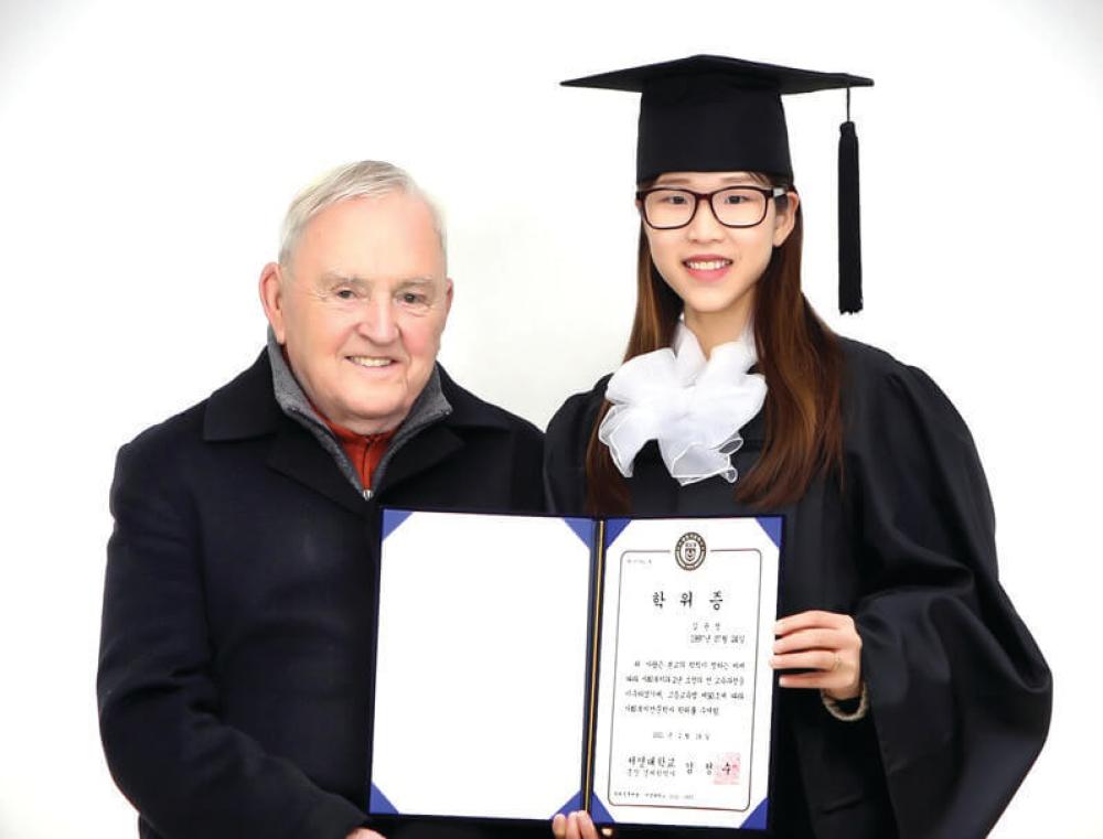 Columban Fr Noel O'Neill with Kim Youn Cheong at her graduation in Korea. Photo: Fr Noel O'Neill SSC