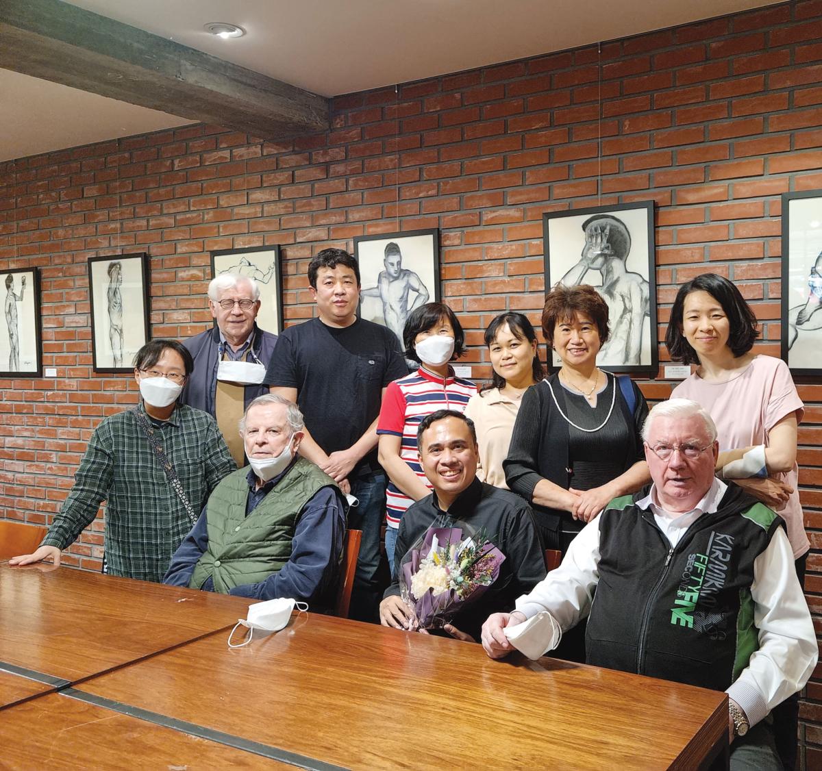 Columban priests and co-workers gather at the exhibition of art work by Fr Jason Antiquera (front centre), Seoul, Korea. - Photo: St Columbans Mission Society