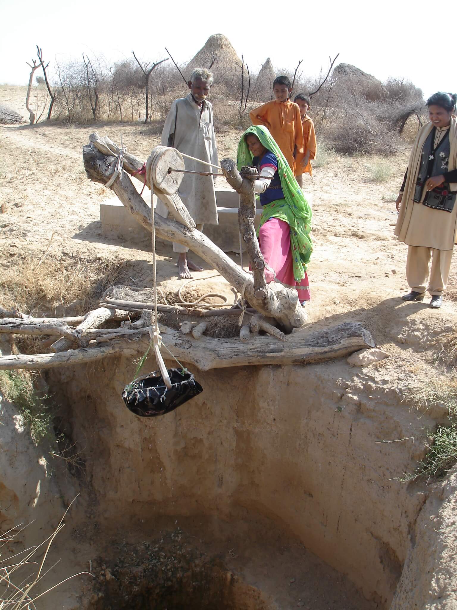 A woman drawing water from well in Pakistan. Photo: St Columbans Mission Society