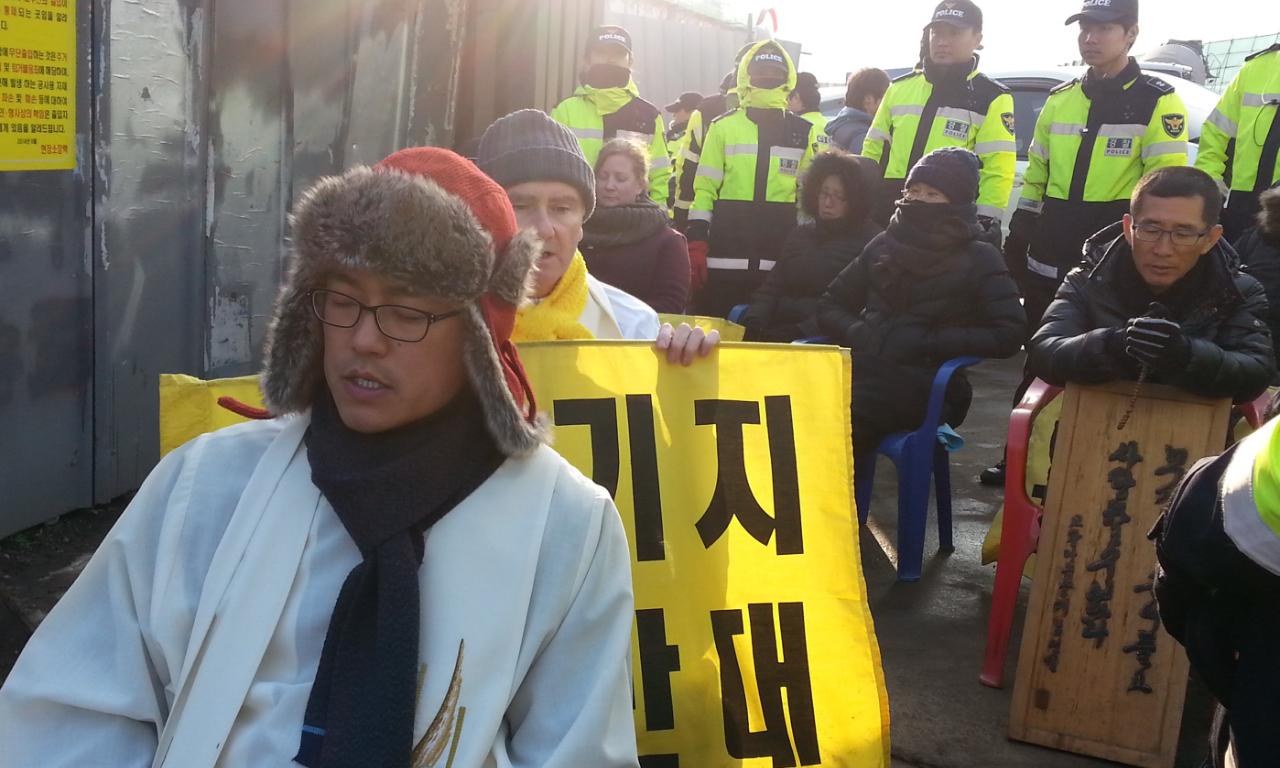 Jeju Island (Korea), peacefully protesting with locals and Columban Father Pat Cunningham. Photo: Amy Echeverria