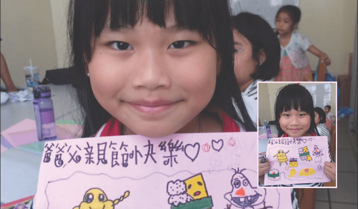 Chou Ting-Yu proudly shows the gift she made for her father on Father’s Day. - Photo: Sherryl Lou Capili